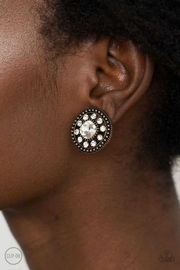 Dazzling Definition - Brass Clip-On Earrings - Paparazzi Accessories
